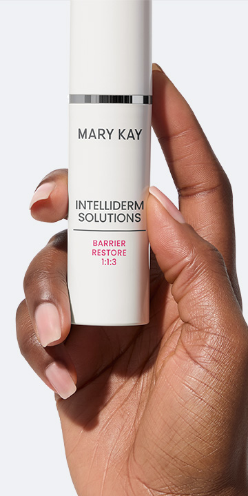 Hand holding bottle of Mary Kay Clinical Solutions Barrier Restore 1:1:3