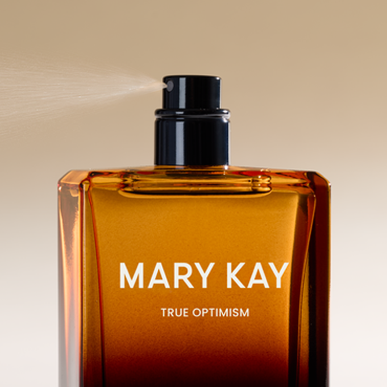 Bottle of True Optimism fragrance, highlighting the sleek design and vibrant color of the perfume.